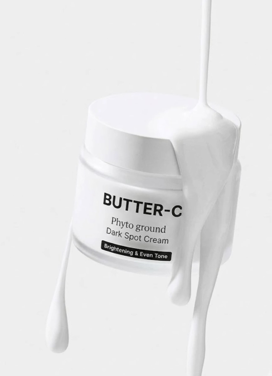 Butter-C Phyto Ground Dark Spot Cream, hũ kem dưỡng sáng mờ đốm nâu với dòng kem trắng chảy qua nắp